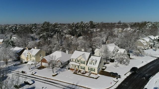 Drone: Snow-covered neighborhoods