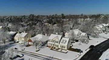 Drone: Snow-covered neighborhoods