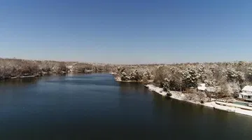 Drone: Chilly water, snow-covered banks