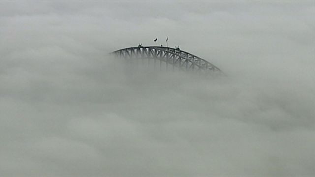 Fog delays flights, blankets Sydney's iconic Harbour Bridge