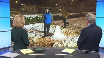 WRAL employees get to enjoy the snow as it continues to fall in Dunn