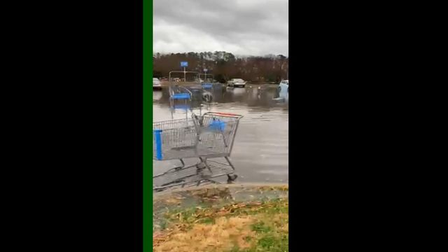 Flash flooding swamps Garner Walmart parking lot
