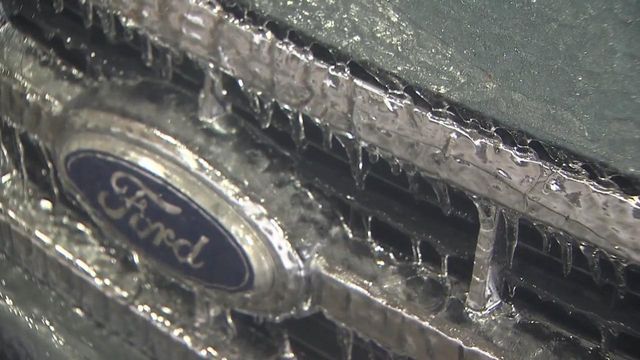 Thick ice weighs on power lines in southern NC
