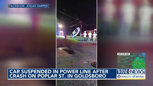 Car crashes, gets caught in power lines
