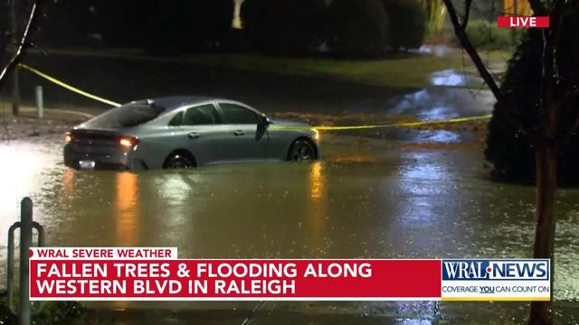 Car becomes submerged in Mission Valley parking lot as storms roll through