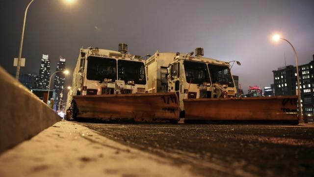 FILE — Sanitation trucks mounted with snow plows are parked on the west side of Manhattan in New York, Jan. 2, 2014. Parts of the Northeast were preparing Monday, Feb. 12, 2024, for a coastal storm that was expected to pack high winds and dump a foot or more of snow in some areas, leading to school closures, warnings against traveling by road and the possible disruption of flights.(AP Photo/Peter Morgan, File) FILE — Sanitation trucks mounted with snow plows are parked on the west side of Manhattan in New York, Jan. 2, 2014. Parts of the Northeast were preparing Monday, Feb. 12, 2024, for a coastal storm that was expected to pack high winds and dump a foot or more of snow in some areas, leading to school closures, warnings against traveling by road and the possible disruption of flights.(AP Photo/Peter Morgan, File)