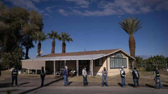 FILE - Farm workers wait in line at Tudor Ranch in Mecca, Calif., Jan. 21, 2021. Every year, heat kills more people than floods, hurricanes and tornadoes combined, and experts warn that extreme heat will become more intense, frequent and lethal with climate change. (AP Photo/Jae C. Hong, File) FILE - Farm workers wait in line at Tudor Ranch in Mecca, Calif., Jan. 21, 2021. Every year, heat kills more people than floods, hurricanes and tornadoes combined, and experts warn that extreme heat will become more intense, frequent and lethal with climate change. (AP Photo/Jae C. Hong, File)