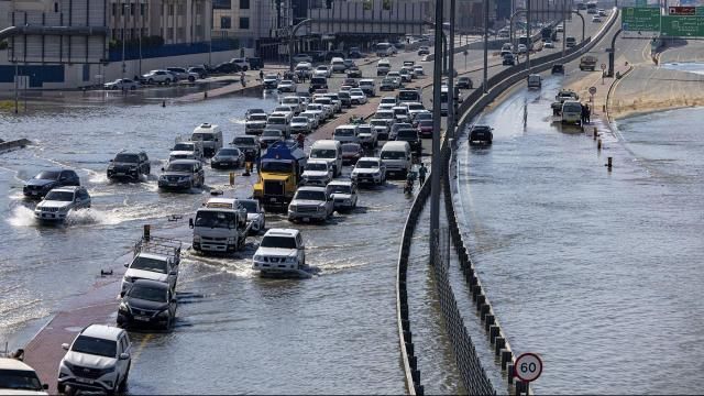 **This image is for use with this specific article only** Vehicles attempt to navigate standing floodwater in Dubai, United Arab Emirates, Thursday, April 18.
Mandatory Credit: Christopher Pike/AP via CNN Newsource. Dateline: DUBAI, United Arab Emirates, April 18, 2024