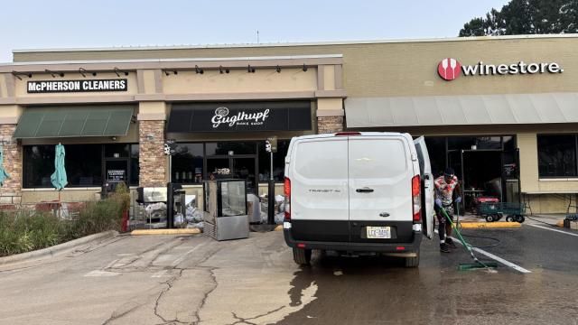 Furniture toppled, door off hinges at Chapel Hill shopping center, cars strewn across parking lot