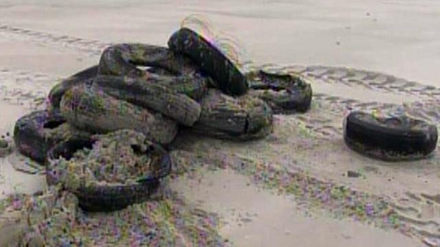 Tires, tourists found in wake of Earl