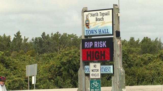 The North Topsail Beach signage shows that there is a high rip current risk.