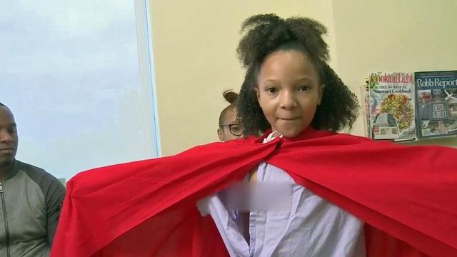 Girl embraces health challenges with strength of super hero