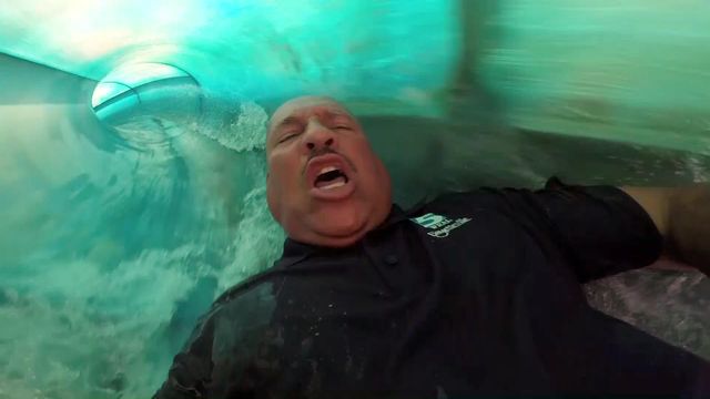 Gilbert Baez goes down a water slide