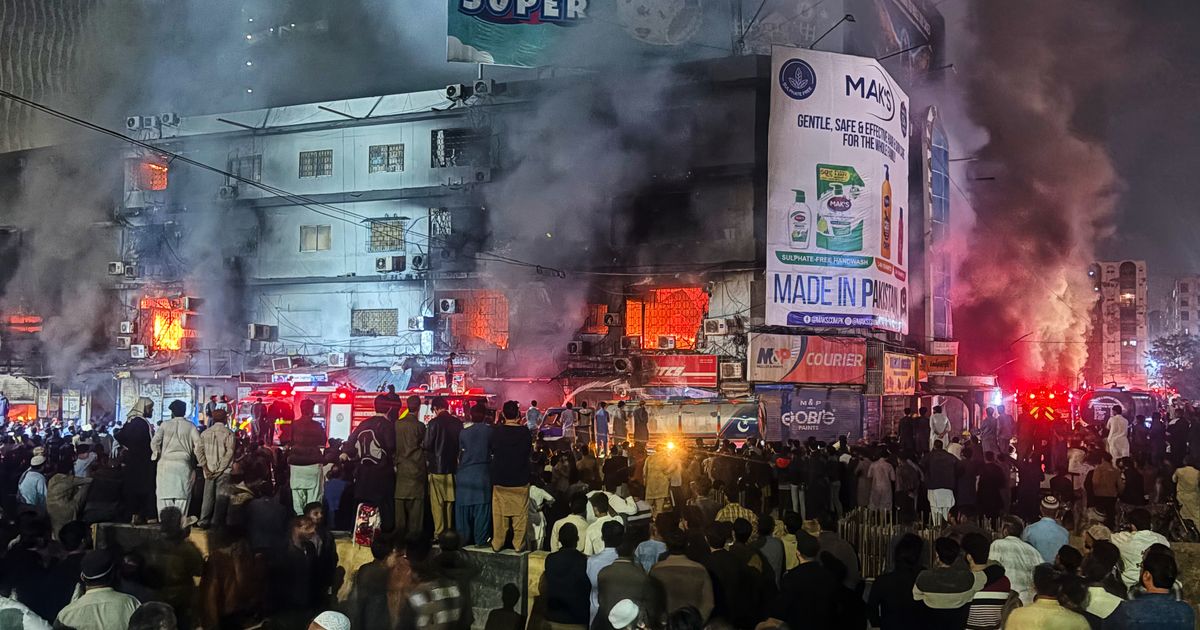 Massive fire engulfs dozens of shops at a shopping mall in southern Pakistan, killing 3 people