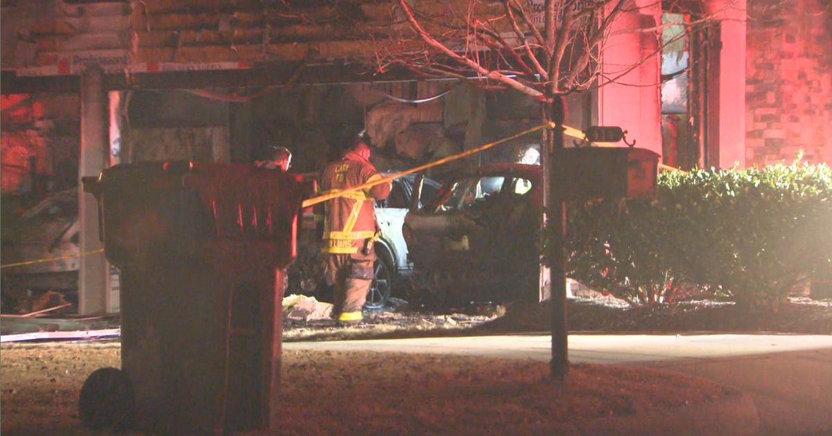 Family displaced after car fire spreads into home, cause under investigation