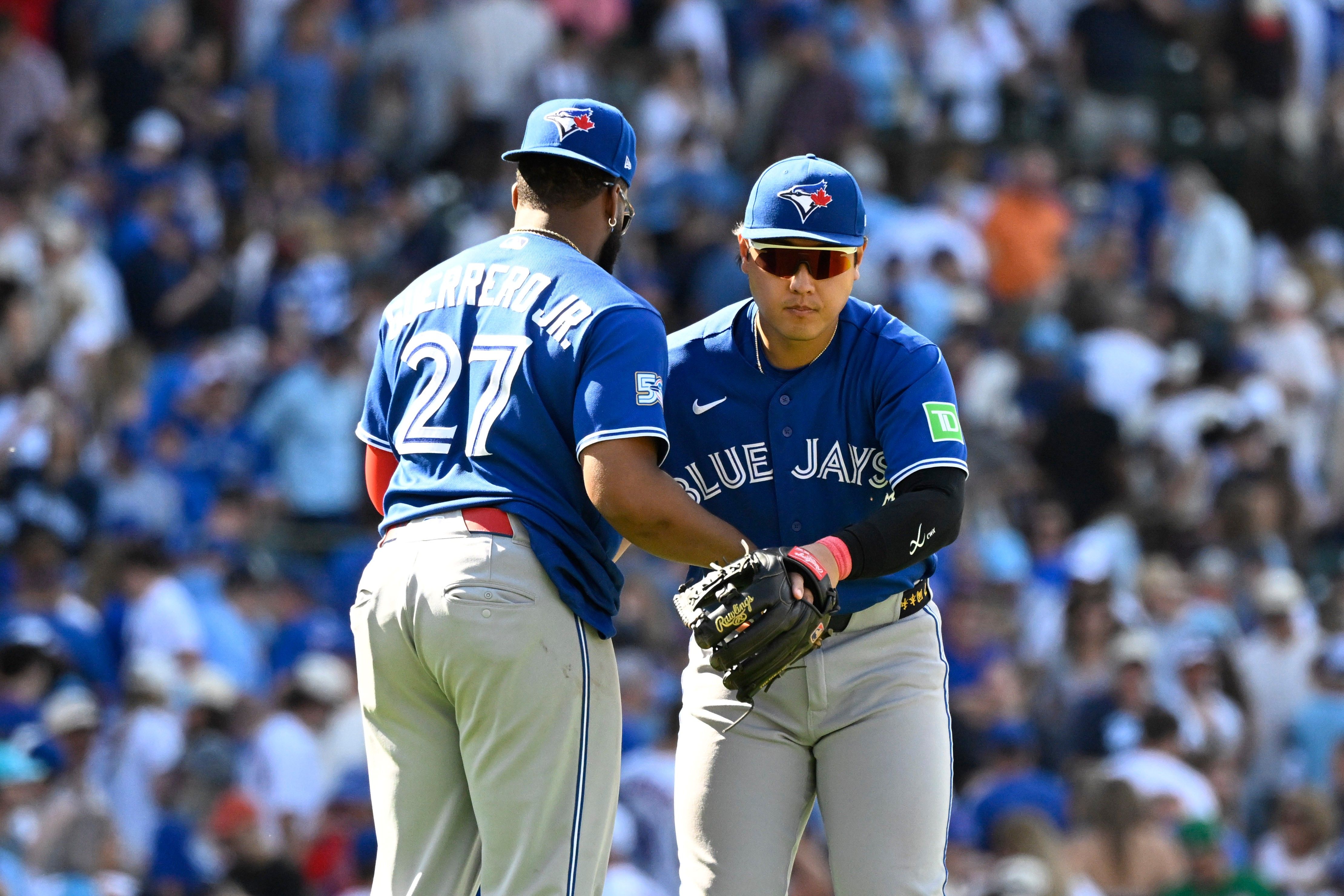 Okamoto hits a 3 - run homer as the Blue Jays rally past the Cubs 8 - 6