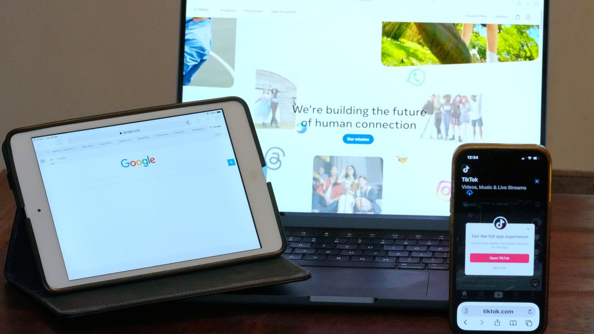 The home pages of Meta, Google and TikTok are displayed on devices in Sydney, Tuesday, April 28, 2026. (AP Photo/Rick Rycroft)