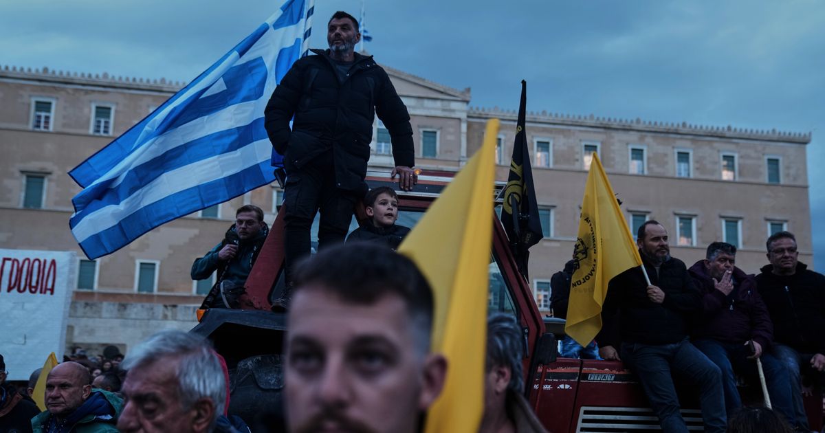 Angry Greek farmers converge on parliament with tractors in overnight protest rally