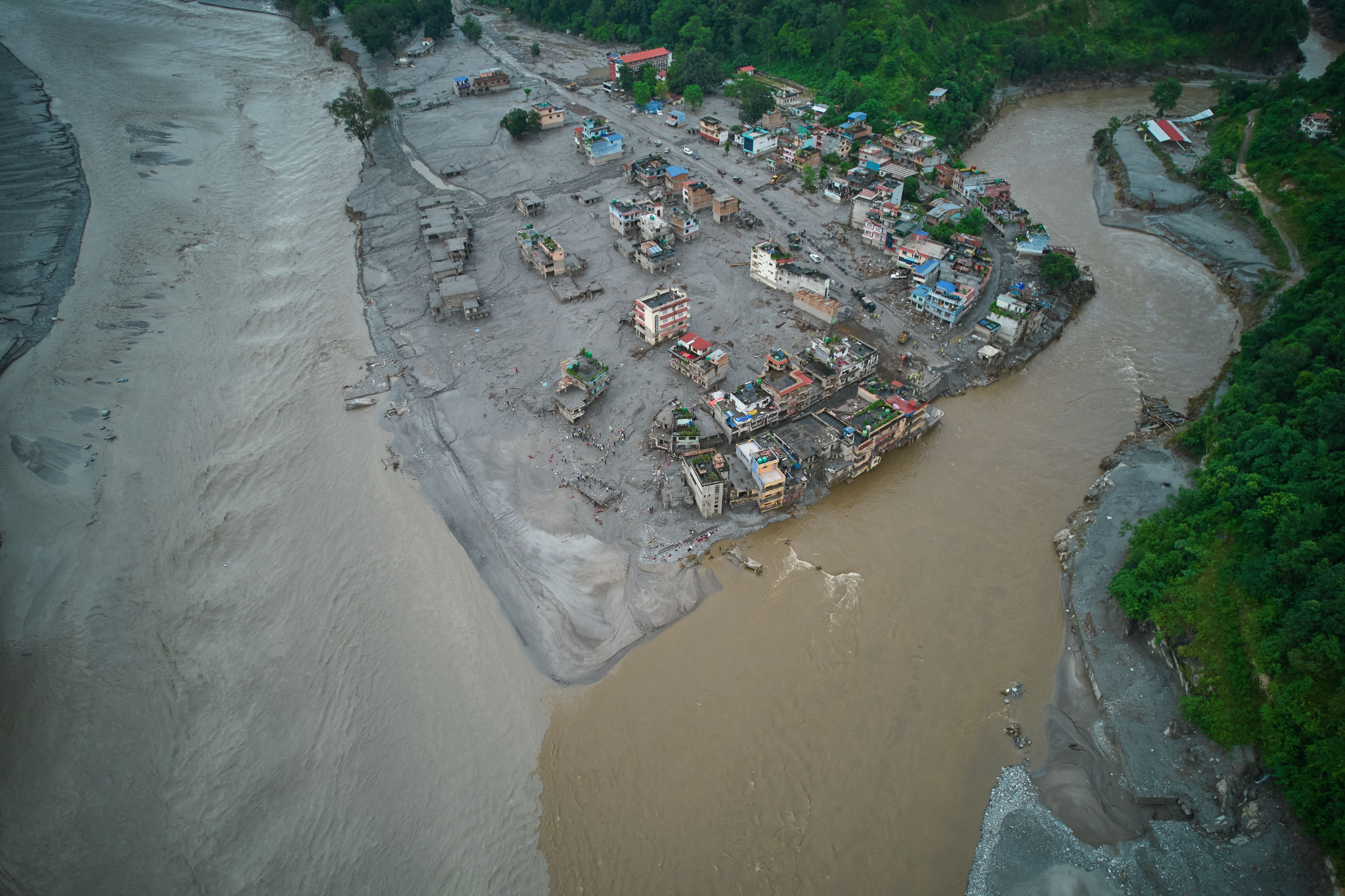 2 trapped workers rescued from a hydropower tunnel 9 days after Nepal floods