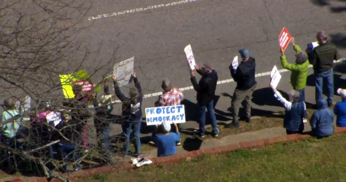 'We can't solve anything unless we talk:' Protesters gather as Tillis ...