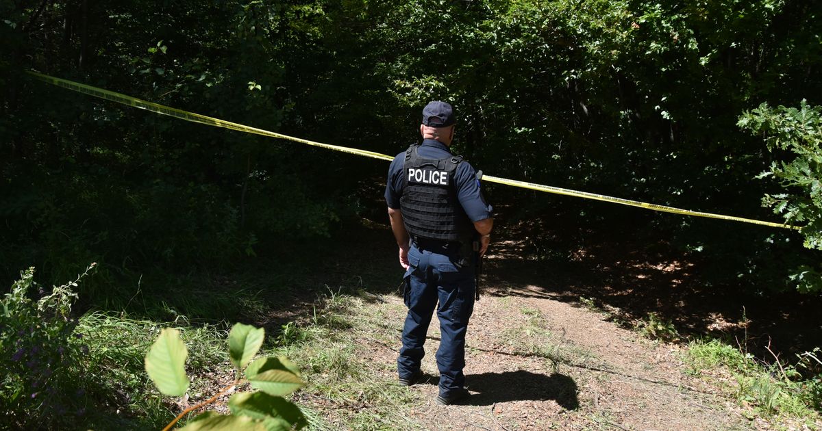 Forensic teams search a suspected mass grave from the Kosovo war