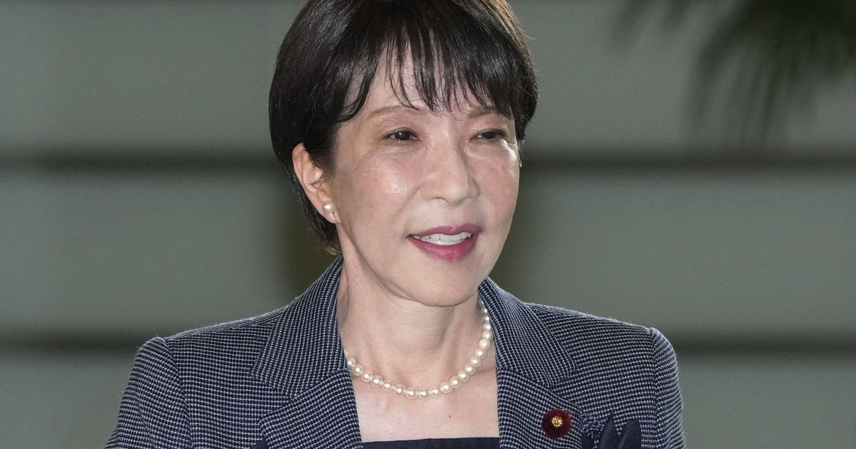 Japan's Prime Minister Sanae Takaichi enters her prime minister's office in Tokyo, Friday, Aug. 21, 2026. (Keisuke
