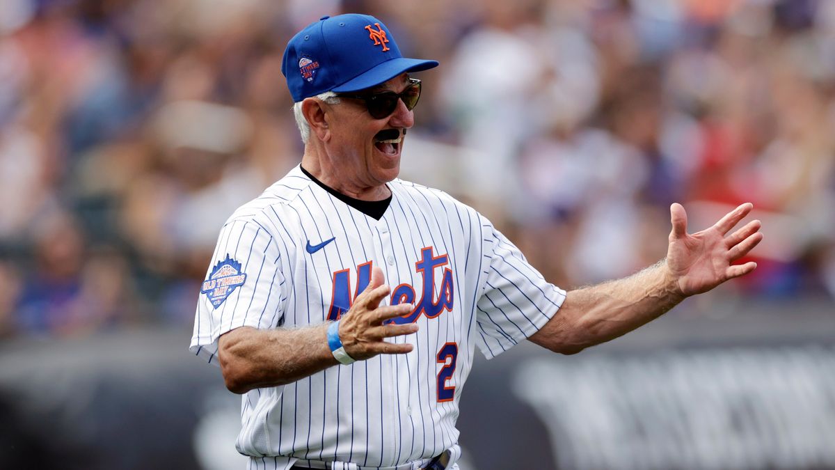 FILE - Former New York Mets' Bobby Valentine, wearing a fake moustache, reacts as he is introduced during an Old-Timers' Day ceremony before a baseball game between the Colorado Rockies and the Mets on Aug. 27, 2022, in New York. (AP Photo/Adam Hunger, File)
