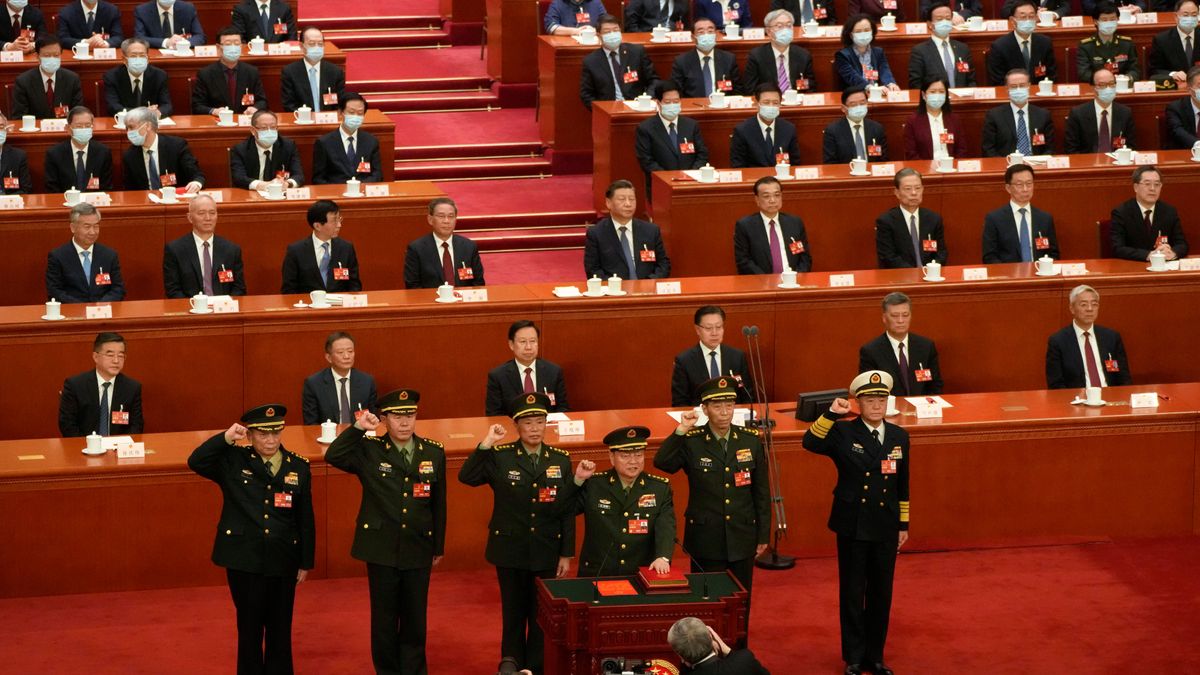 FILE - Chinese President Xi Jinping, center, watches as members of the Central Military Commission takes their oath during a session of China's National People's Congress (NPC) at the Great Hall of the People in Beijing, China on March 11, 2023. (AP Photo/Mark Schiefelbein, File)