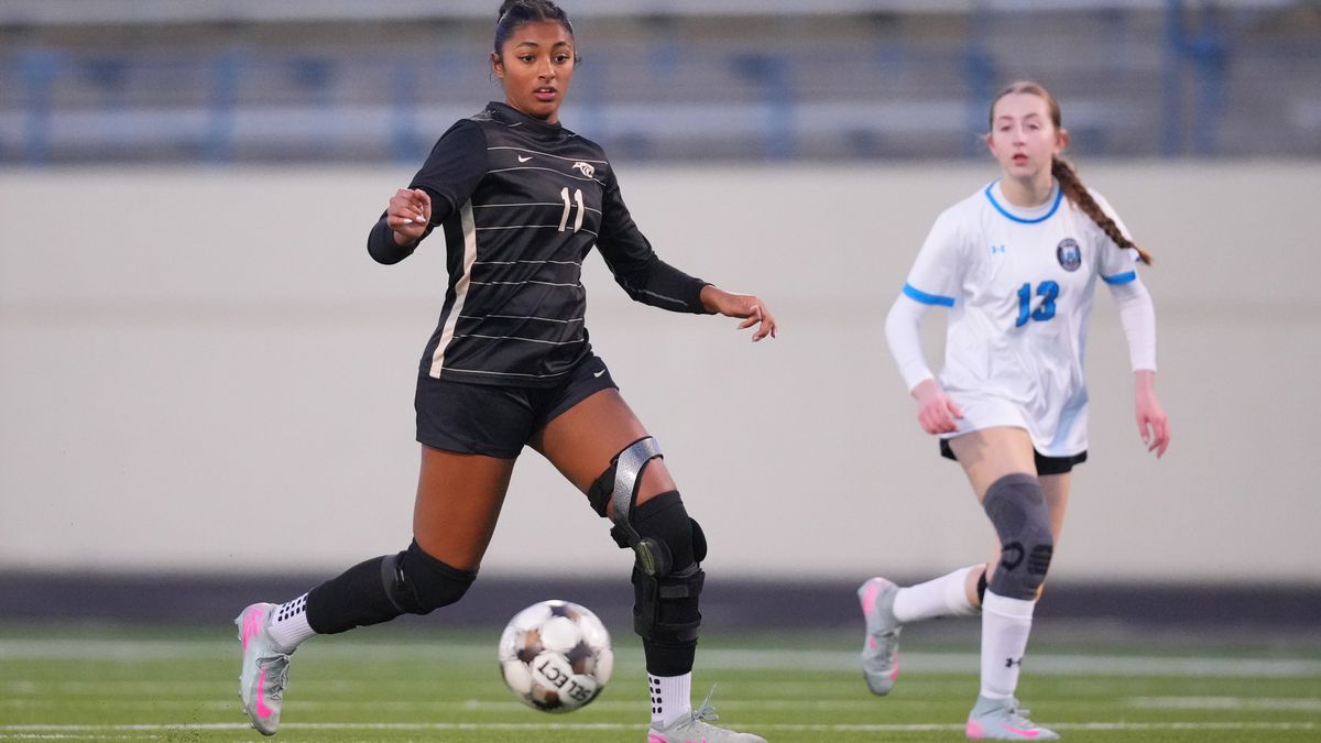 Plano East varsity soccer player Aliya Jacob, left, controls the ball against Rock Hill's Hanna Schinner during a soccer game, Jan. 30, 2026, in Murphy, Texas. (AP Photo/Julio Cortez)