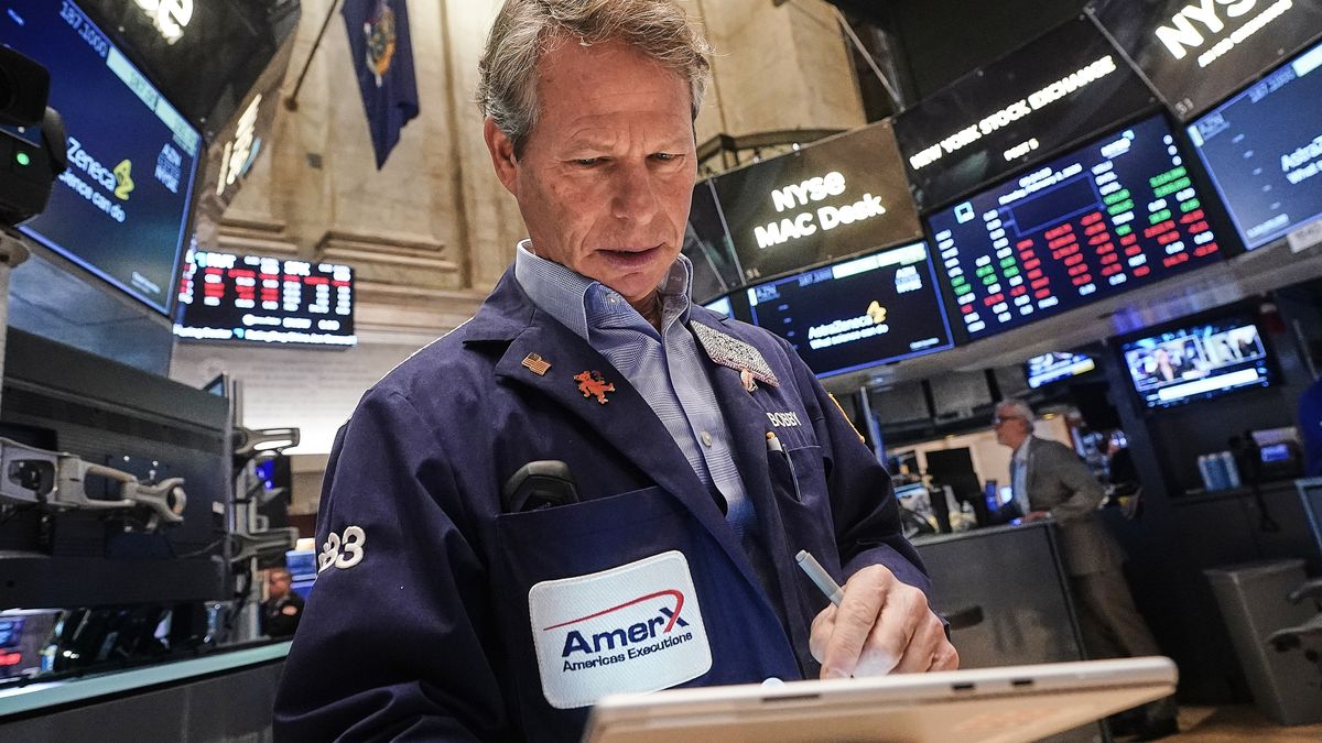 Trader Robert Charmak works on the floor of the New York Stock Exchange, Monday, Feb. 2, 2026. (AP Photo/Richard Drew)
