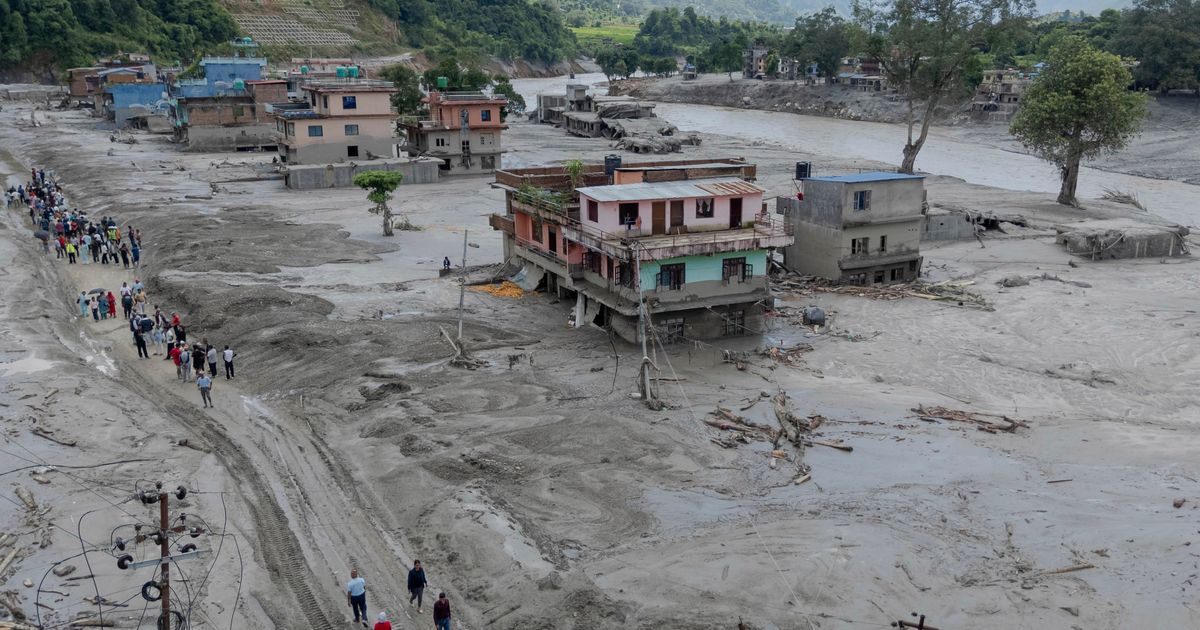 In this photo released by Xinhua News Agency, a drone photo shows a flood-hit area in Nuwakot, Nepal on Thursday, Aug. 27