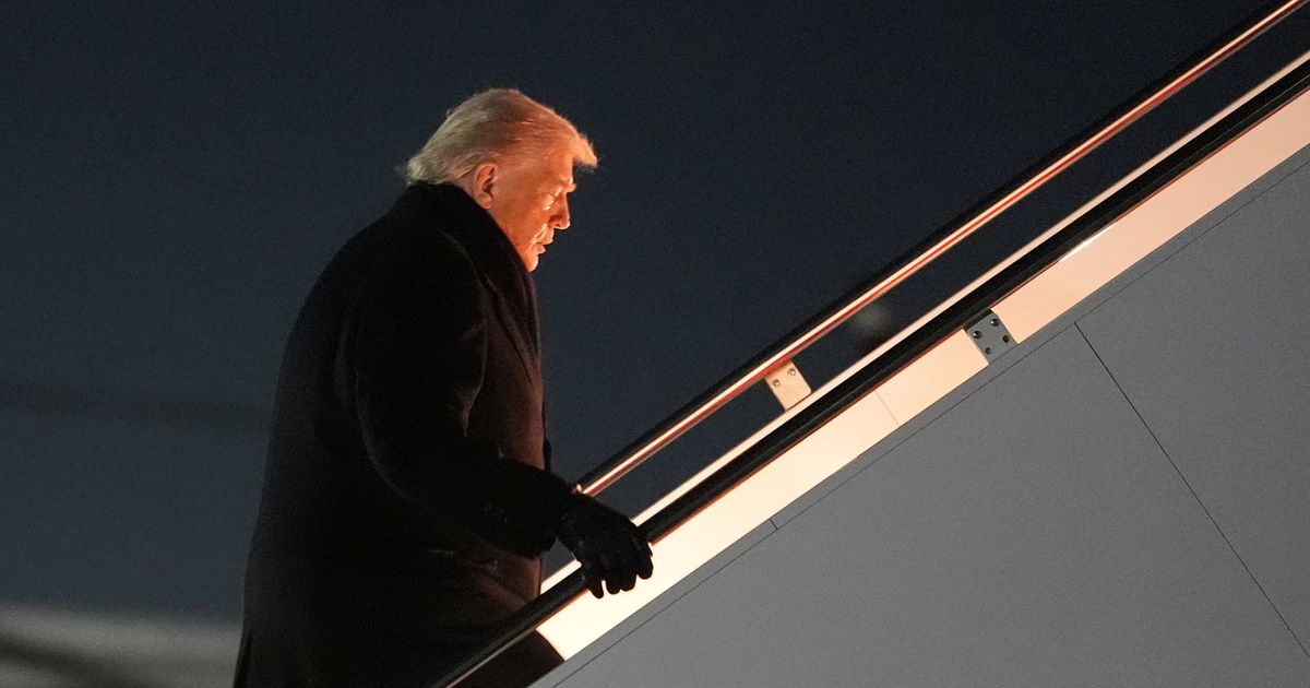 The Latest: Trump lands in Switzerland after delay caused by switching aircraft