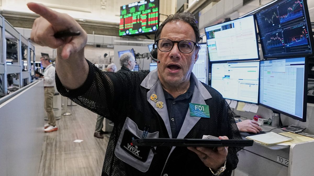 Options trader Anthony Spina works on the floor of the New York Stock Exchange, Friday, Nov. 21, 2025. (AP Photo/Richard Drew)