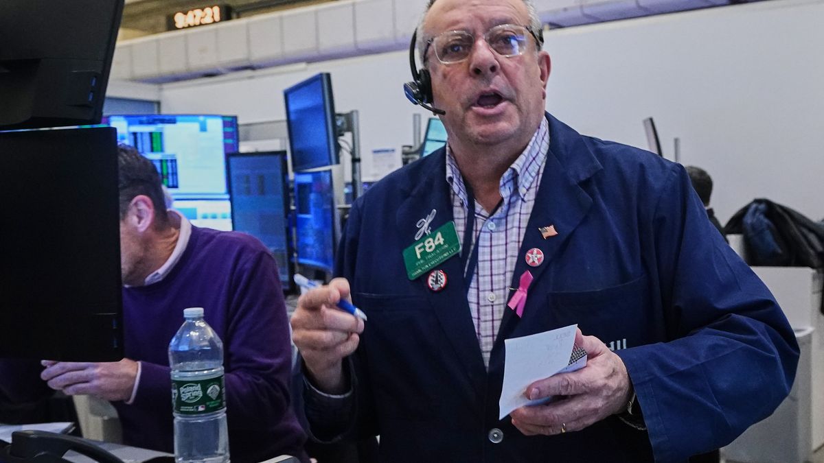 Options trader Phil Fracassini works on the floor of the New York Stock Exchange, Thursday, Nov. 20, 2025. (AP Photo/Richard Drew)